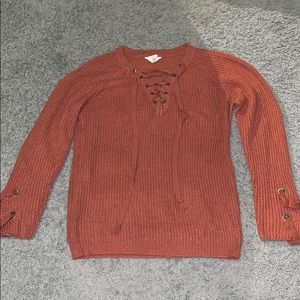 A knitted drawstring sweater.